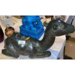 A bronze figure of a reclining camel, length 46 cm (filled)