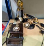 A vintage style wall mounted telephone in brass and wood, 33 cm; a similar stick telephone;