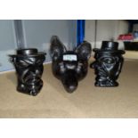 A fox head cast iron doorstop; 2 tobacco jars in the form of a man's head with hat