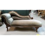 A Victorian walnut chaise longue with scroll back, on knurled legs and castors, fawn dralon