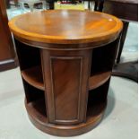 A Georgian style crossbanded mahogany revolving circular bookcase