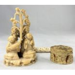 A Chinese miniature carved ivory group; a miniature box and a carved needle case