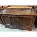 An 18th century country made oak mule chest, framed and panelled with plank top and 2 base