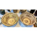 An 18th/19th century pair of large Hispano-Moresque bowls of tapering form, tin glazed with copper