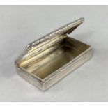 A Georgian rectangular silver snuff box with engine turned ribbed decoration and embossed border (