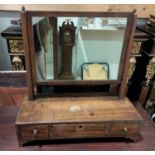 A Georgian dressing table mirror in mahogany rectangular frame, with reeded columns and 3 base