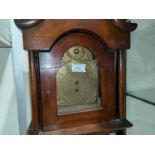 A dwarf longcase clock, the oak case with swan neck pediment and turned pillars to the hood and