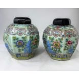 A Chinese pair of octagonal jars, celadon glaze with raised polychrome decoration in the famille