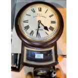 A small drop dial wall clock in stained mahogany case, with single train fusee movement by Gillett