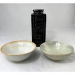 A Chinese glazed bowl with stepped rim and a similar Chinese bowl, diameters 15cm and 17cm; a