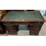 A 19th century mahogany kneehole desk with inset top, 6 pedestal and 3 frieze drawers, width 122 cm