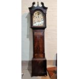An early 19th century figured mahogany longcase clock with brass ball finial, swan neck pediment and