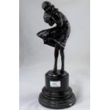 A modern bronze figure in the Art Deco style, woman with muff on a windy day, height 38 cm
