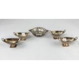 A set of 4 classical oval pedestal 2 handle hallmarked silver salts with ribbed bodies, on