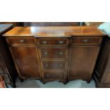 A Georgian style crossbanded mahogany breakfront side cabinet with 3 frieze and 3 central drawers