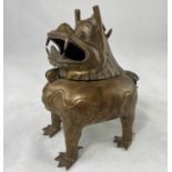 A Chinese bronze incense burner in the form of mythical creature with hinged head, height 14cm