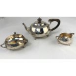 A 3-piece planished Arts and Crafts hallmarked silver tea service comprising tea pot, milk jug and