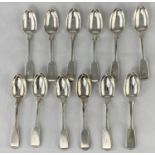 A set of 12 monogrammed fiddle pattern tea spoons, Exeter 1858, maker Josiah and John Williams, 10.
