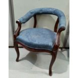 A 19th century mahogany tub shaped office armchair in blue fabric