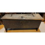 A late 17th/early 18th century country made 6 plank chest of small proportions, the lid with