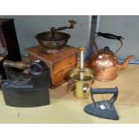 A vintage coffee grinder; a 19th century pestle and mortar 2 irons; a copper kettle