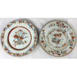 A Chinese plate with polychrome decoration of various flowers, diameter 23cm with old staple