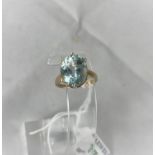 A lady's 9 carat hallmarked gold dress ring set large aquamarine coloured stone, size N.5, 4.3 g