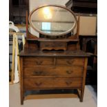 A 1920's mahogany Georgian style dressing chest with oval swing mirror, 107cm