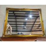 A large bevelled edge wall mirror in rectangular gilt frame, length 137 cm