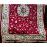 A Kashmir rug with floral medallion pattern on red ground, 240 x 160 cm