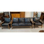 A Danish rosewood framed lounge suite comprising 3 seater settee and 2 armchairs, with black leather