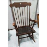 A stick back rocking chair