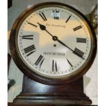 A wall/mantel clock in stained wood round case, single train fusee movement by Thos Armstrong