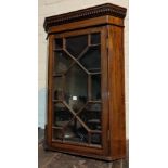 A 19th century small corner cupboard with astragal glazing