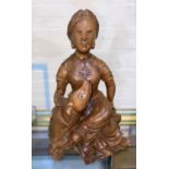 A Chinese carved wooden figure of a seated lady with dog, height 24cm