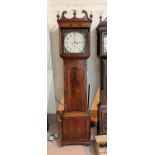An early 19th century inlaid mahogany longcase clock with brass finials and square reeded columns to
