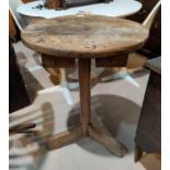 An 18th century circular elm top pedestal occasional table