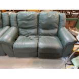 A 2 seater green leather reclining settee