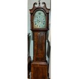 A 19th century crossbanded figured mahogany longcase clock with swan neck pediment and reeded