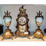A 19th century French 3 piece clock garniture in ornate gilt metal and porcelain decorated with