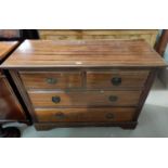 An Edwardian mahogany chest of 2 long and 2 short drawers, with ring handles