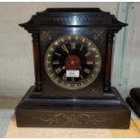 A 19th century mantel clock in black marble architectural case, with turned side columns and incised
