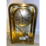 A late 19th/early 20th century mantel clock in brass case of rounded rectangular form with