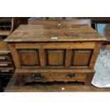 A Georgian oak framed coffer back with hinged lid, 3 fielded panels and base drawer, with shaped