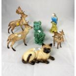 A selection of Beswick and other animal figures: 2 stags; Siamese cat, budgerigar; etc.