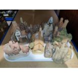 A collection of David Winter miniature cottages etc