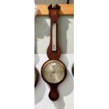 A late 19th century mercury column barometer with thermometer in mahogany banjo shaped case with