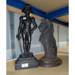 Two cast iron doorstops: seated lion and Napoleonic soldier
