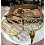 A pike end brass poker; 2 pierced brass trivets; a pair of bellows; a brass hand bell