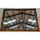 A bevelled edge wall mirror in barbola type rectangular frame, decorated with painted fruit, 72 x 47